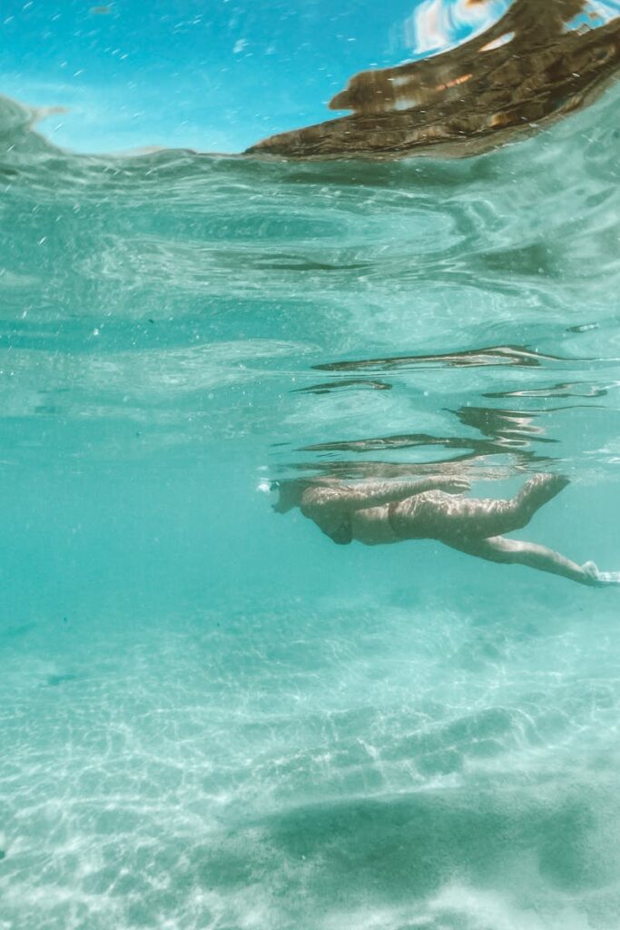 Underwater scene of a snorkeler exploring the vibrant ocean.